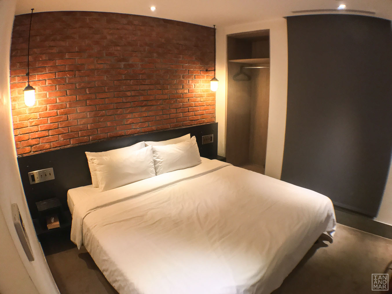 bedroom with brick wall